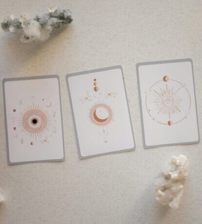 Top view of tarot cards and crystals, perfect for spiritual and mystical themes.